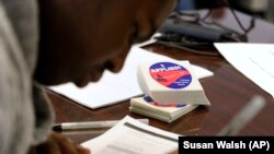 A student at Roosevelt High School in Washington, DC fills out a college enrollment application. President Barack Obama’s goal is that by 2020, America will again have the highest proportion of college graduates in the world.