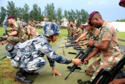 A photograph of Chinese Marines training South African troops on an unspecified date posted to the Website of Air University, Maxwell Air Force Base. (Dr. Ernest Gunasekara-Rockwell).