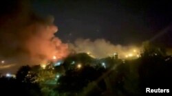 FILE - A view of smoke rising from Evin Prison in Tehran, Oct. 15, 2022, in this still image take from a video obtained by Reuters.