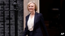 Britain's Prime Minister Liz Truss leaves 10 Downing Street to attend the weekly Prime Ministers' Questions session in parliament in London, Oct. 19, 2022.