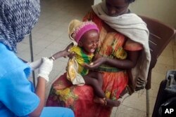 FILE - Medhin Gereziher, 1, is treated for malnutrition at the Ayder Referral Hospital in Mekele, in the Tigray region of northern Ethiopia, Oct. 4, 2022.