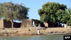FILE - The village of Blaram on the Logone river is seen during normal water levels, at the Cameroon-Chad border, March 1, 2013. Recent flooding has devastated the region.