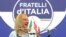 FILE - Brothers of Italy leader Giorgia Meloni speaks to reporters at her party's electoral headquarters in Rome, Sept. 26, 2022.