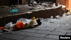 Debris is seen at the scene where many people died and were injured in a stampede during a Halloween festival in Seoul, South Korea, Oct. 30, 2022.