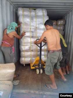 Workers load packed tea on to a truck to be exported, in the Ilam district of Nepal(Photo courtesy Kamal Raj Mainali)