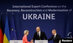 German Chancellor Olaf Scholz, Ukrainian Prime Minister Denys Shmyhal and EU Commission President Ursula von der Leyen attend a joint news conference during a post-war reconstruction of Ukraine conference in Berlin, Oct. 25, 2022.