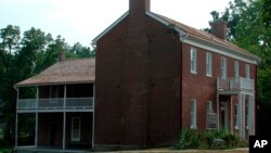 FILE - This undated photo shows the Shawnee Indian Mission in Fairway, Kan. A plan to search for unmarked graves at the former Native American boarding school is on hold amid a disagreement between a Shawnee Tribe and state and city officials.