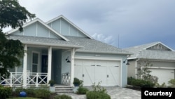 The homes at Babcock Ranch were designed to withstand hurricane-force winds. They sustained practically no damage during Hurricane Ian on Sept. 28, 2022, which brought winds over 160 kph. At right, a few shingles were torn off the roof of a garage. (Courtesy Babcock Ranch)