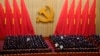 Attendees bow their heads to observe a moment of silence for fallen comrades during the opening ceremony of the 20th National Congress of China's ruling Communist Party held at the Great Hall of the People in Beijing, China, Oct. 16, 2022.