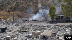 FILE - A partial view shows the aftermath of Iranian cross-border attacks in the area of Zargwez, on Sept. 28, 2022. 