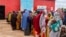 FILE - Somali women and children who left rural areas due to drought receive nutritional assistance at a camp for the internally displaced, on the outskirts of Baidoa, Somalia, Oct. 12, 2022.