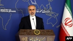 FILE - Iran's Foreign Ministry spokesman Nasser Kanani holds a press conference in Tehran, July 13, 2022. Kanani "strongly condemned" the decision by France to host a meeting July 1, 2023, with an exiled Iranian opposition group.