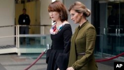 Olena Zelenska, right, wife of Ukrainian's President Volodymyr Zelenskyy, walks out of the State Department, July 18, 2022 in Washington, after meeting with Secretary of State Antony Blinken.