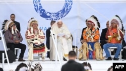 Pope Francis (C) speaks to members of the Indigenous community at Muskwa Park in Maskwacis, Alberta, Canada, July 25, 2022. 