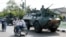 FILE - Indonesian soldiers patrol the streets of Lhokseumawe, June 24, 2003, in the restive province of Aceh, Indonesia. 