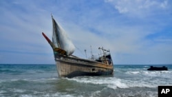 A boat used to carry ethnic Rohingya rests on Indra Patra beach in Ladong village, Aceh province, Indonesia, Dec. 25, 2022. 