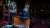 Burned furniture, including wooden tables and chairs, and religious imagery are seen at the site of a fire inside the Abu Sefein Coptic church in the densely populated neighborhood of Imbaba, Cairo, Egypt, Aug. 14, 2022.