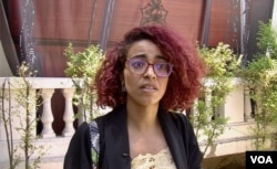 Yousra Chikhaoui says she was slapped by police covering a July demonstration in Tunis. (Lisa Bryant/VOA)