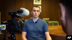 Ukrainian Health Minister Viktor Liashko speaks to The Associated Press reporters during an interview on Friday, Aug. 12, 2022.