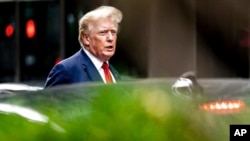 FILE - Former President Donald Trump departs Trump Tower in New York, Aug. 10, 2022.