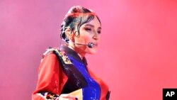 FILE - Turkish pop star Gulsen performs during a concert in Istanbul, on April 10, 2016.