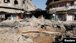 A crater made by an airstrike against Islamic State militants is seen in Mosul, Iraq, Feb. 3, 2017. 