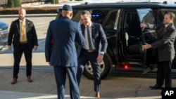 U.S. Defense Secretary Pete Hegseth, center, returns a salute to Chairman of the Joint Chiefs of Staff Gen. Charles Brown, as he arrives at the Pentagon, Jan. 27, 2025, near Washington.