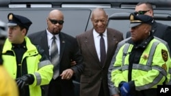 FILE - Actor and comedian Bill Cosby, center right, arrives for a court appearance, Feb. 3, 2016, in Norristown, Pennsylvania.