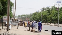 FILE - People flee the northeastern Nigerian city of Maiduguri in Borno State, May 14, 2015.