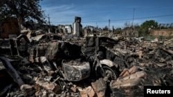 Residential houses destroyed by a Russian military strike are seen as Russia's attacks on Ukraine continue, in the town of Orikhiv, Zaporizhzhia region, Ukraine Aug. 27, 2022. 