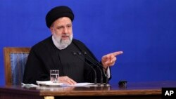 FILE - In this photo released by the office of the Iranian Presidency, President Ebrahim Raisi speaks during a press conference in Tehran, Iran, Aug. 29, 2022.