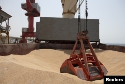 Wheat grain is seen on the MV Brave Commander vessel from Yuzhny Port in Ukraine to the drought-stricken Horn of Africa as it docks in Djibouti, Aug. 30, 2022. (Hugh Rutherford/World Food Program/Handout via Reuters)