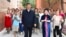 FILE - In this photo released by China's Xinhua News Agency, Chinese President Xi Jinping, center, visits the community of Guyuanxiang in the Tianshan District in Urumqi in northwestern China's Xinjiang Uyghur Autonomous Region, July 13, 2022. 