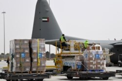 FILE - Medical equipment and coronavirus testing kits provided by the World Health Organization are pictured at the al-Maktum International airport in Dubai, March 2, 2020.