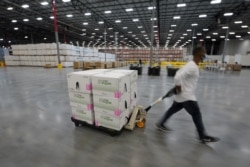 FILE - Boxes containing the Moderna COVID-19 vaccine are prepared to be shipped at the McKesson distribution center in Olive Branch, Mississippi, U.S. December 20, 2020. (Paul Sancya/Pool via REUTERS/File Photo/File Photo)