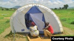 Many of the Nigerian refugees are living in tents or makeshift shelters in host communities. Photo: Ntaryike Divine Jr./VOA