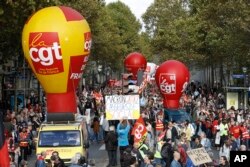 Protestors march during a demonstration against the labor reforms in Paris, Oct. 19 2017.