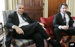 FILE - Sen. Charles Schumer, D-N.Y., meets with Brett Kavanaugh, right, then-nominee for the D.C. Circuit Court, on Capitol Hill, May 2, 2006.
