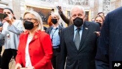 FILE - Former Vice President Dick Cheney walks with his daughter Rep. Liz Cheney, R-Wyo., vice chair of the House panel investigating the Jan. 6 U.S. Capitol insurrection, in the Capitol Rotunda in Washington, Jan. 6, 2022.