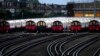 Kereta jalur Piccadilly parkir di depot mereka di London, saat anggota serikat pekerja Rail, Maritime and Transport (RMT) melancarkan aksi mogok, Jumat, 19 Agustus 2022. (AP/Frank Augstein)