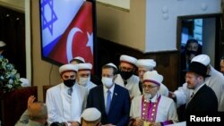 FILE - Israeli President Isaac Herzog attends a ceremony during his visit at the Neve Shalom Synagogue in Istanbul, Turkey, March 10, 2022.