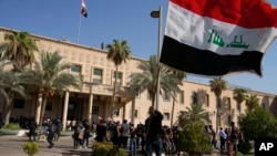 Supporters of Shiite cleric Muqtada al-Sadr demonstrate in the grounds of the Government Palace in Baghdad, Iraq, Aug. 29, 2022. The chaos sparked fears that violence could erupt in a country already beset by its worst political crisis in years.