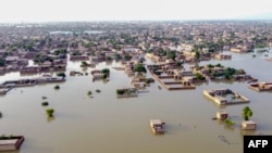 This aerial view shows a flooded residential area after heavy monsoon rains in Balochistan province of Pakistan on Aug. 29, 2022. 