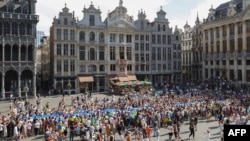 Participants take part of a ceremony at the Grand-Place in Brussels to celebrate Ukraine's Independence Day on Aug. 24, 2022.