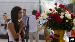 A woman prays at the famous Shwedagon Pagoda, Nov. 28, 2017, in Yangon, Myanmar. The #MeToo movement opens up the conversations on sexual harassment in Myanmar.
