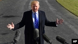 FILE - In a Saturday, Dec. 16, 2017 file photo, President Donald Trump talks with reporters as he departs from the South Lawn of the White House.