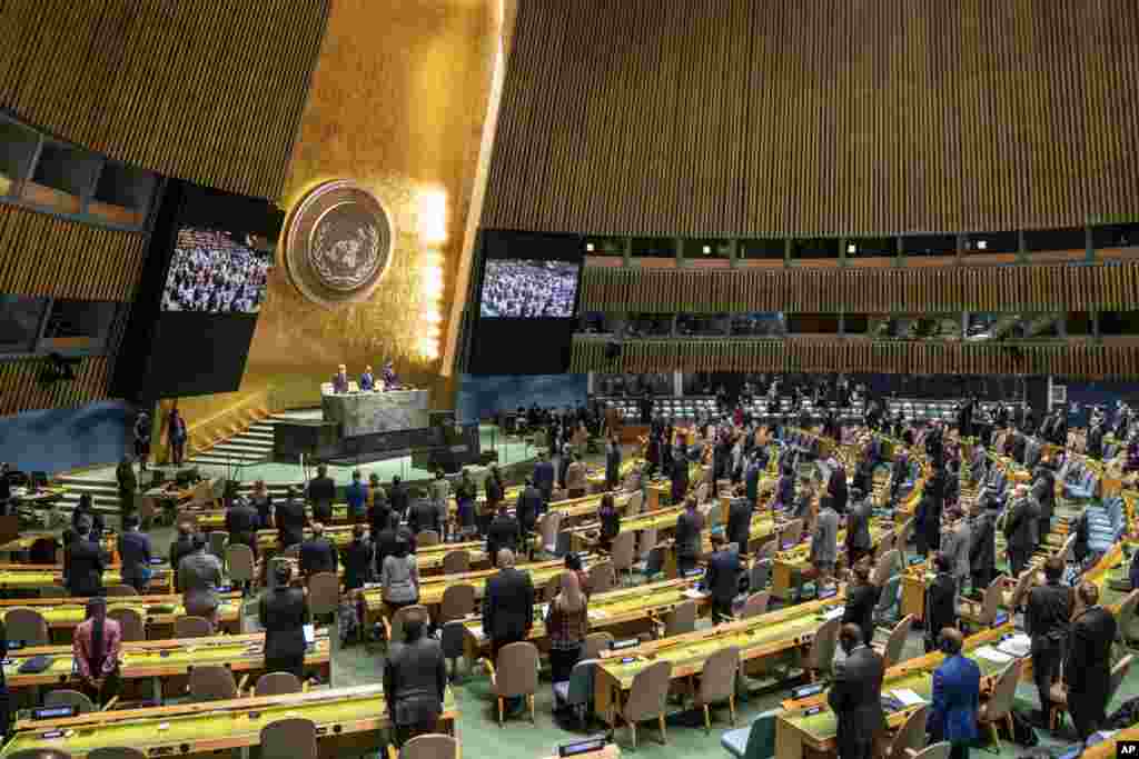 Delegations stand for a moment of silence during an emergency session of the U.N. General Assembly, Feb. 28, 2022, at United Nations Headquarters in New York.
