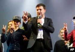 FILE - Volodymyr Zelenskyy, Ukrainian actor and then-presidential candidate, hosts a comedy show at a concert hall in Brovary, Ukraine, March 29, 2019.