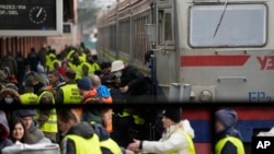 Displaced persons fleeing Russia's invasion of Ukraine crowd a platform at the train station in Przemysl, Poland, March 3, 2022. 