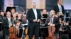 FILE - Russian conductor Valery Gergiev performs on stage with the Vienna Philharmonic Orchestra at Schoenbrunn Palace in Vienna, Austria, Sept. 18, 2020. 